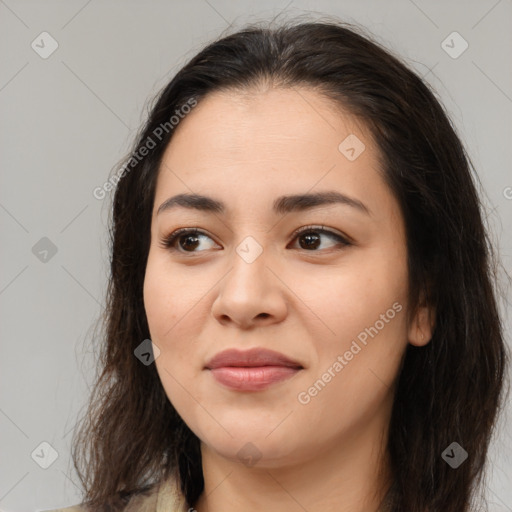 Joyful asian young-adult female with long  brown hair and brown eyes