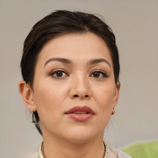 Joyful white young-adult female with medium  brown hair and brown eyes