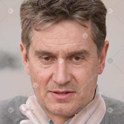 Joyful white middle-aged male with short  brown hair and grey eyes