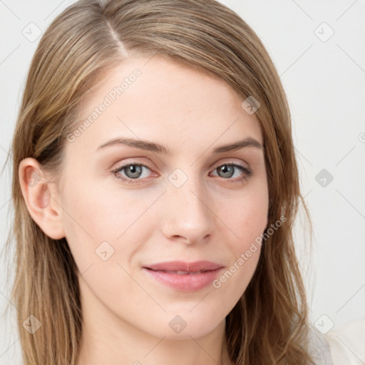 Joyful white young-adult female with long  brown hair and blue eyes