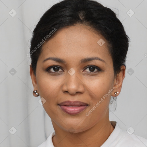 Joyful latino young-adult female with short  brown hair and brown eyes