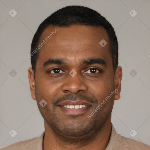 Joyful black young-adult male with short  black hair and brown eyes
