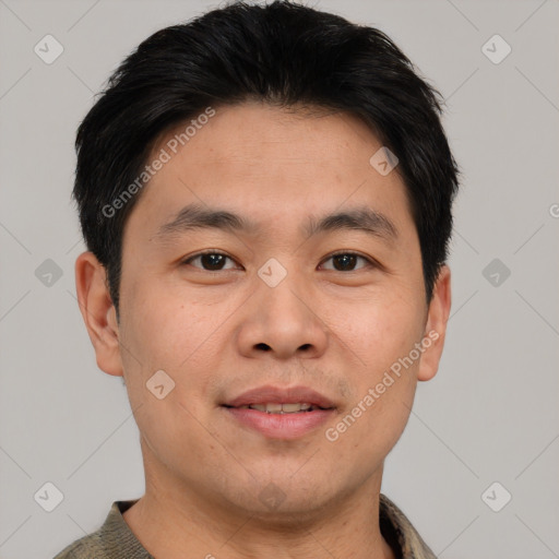 Joyful asian young-adult male with short  brown hair and brown eyes