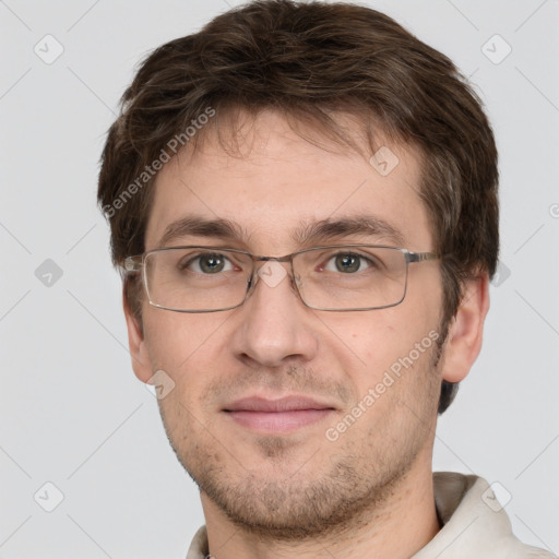 Joyful white adult male with short  brown hair and grey eyes