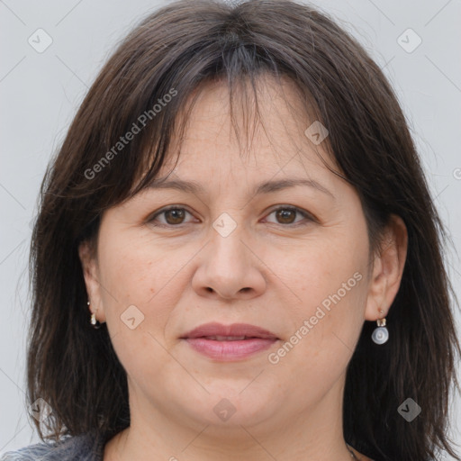 Joyful white adult female with medium  brown hair and brown eyes