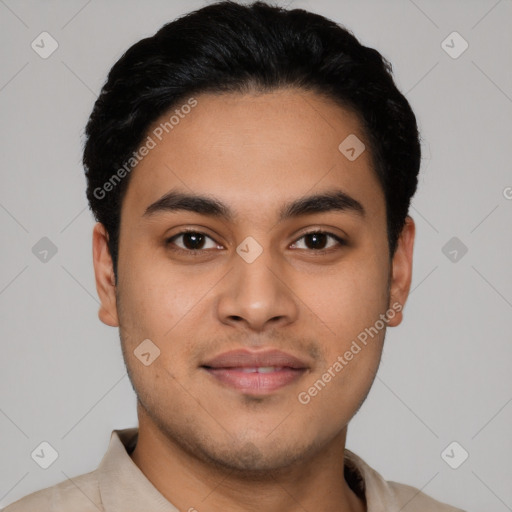 Joyful latino young-adult male with short  black hair and brown eyes