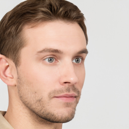 Neutral white young-adult male with short  brown hair and grey eyes