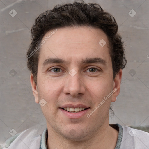 Joyful white adult male with short  brown hair and grey eyes