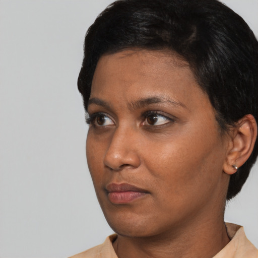 Neutral black adult female with short  brown hair and brown eyes