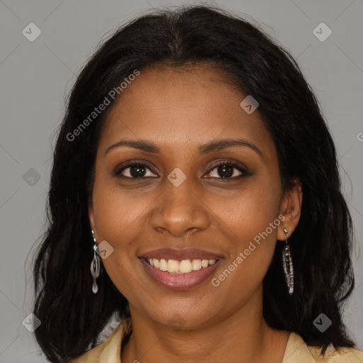 Joyful black young-adult female with long  brown hair and brown eyes