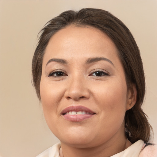 Joyful white adult female with medium  brown hair and brown eyes