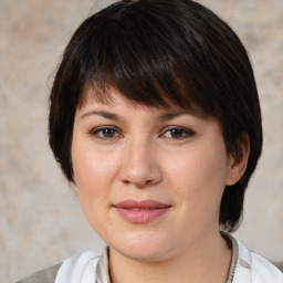 Joyful white young-adult female with medium  brown hair and brown eyes