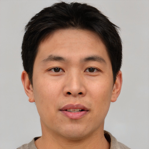 Neutral asian young-adult male with short  brown hair and brown eyes