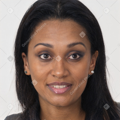 Joyful black young-adult female with long  brown hair and brown eyes