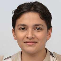 Joyful white young-adult female with short  brown hair and brown eyes