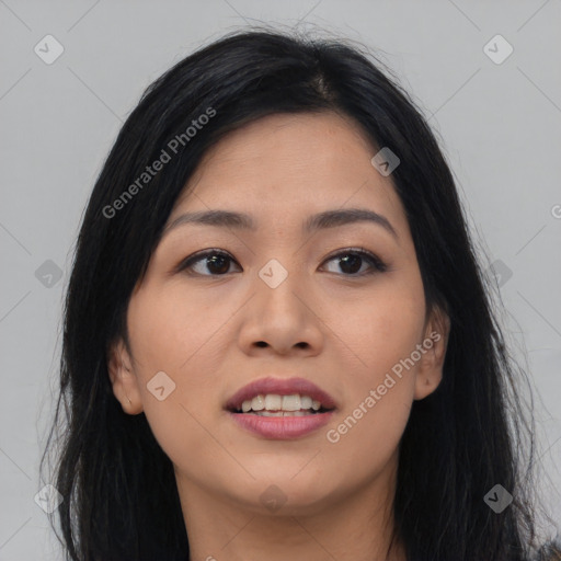 Joyful asian young-adult female with long  black hair and brown eyes