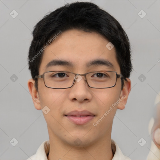 Joyful asian young-adult male with short  brown hair and brown eyes