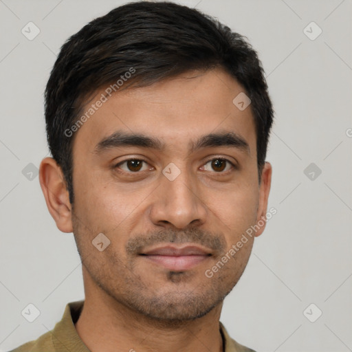 Joyful latino young-adult male with short  black hair and brown eyes