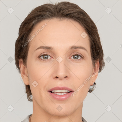 Joyful white adult female with short  brown hair and grey eyes