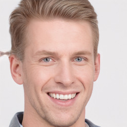 Joyful white adult male with short  brown hair and grey eyes