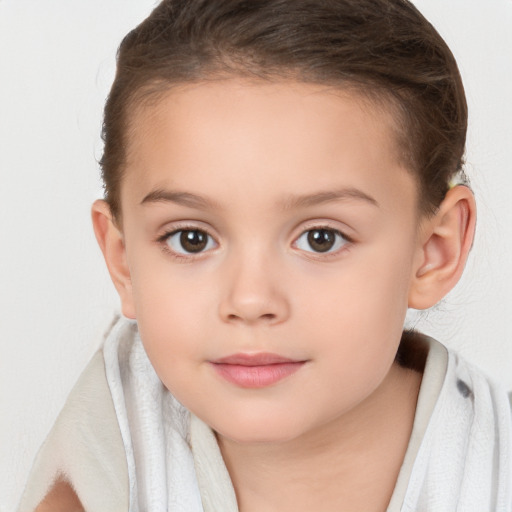 Joyful white child female with short  brown hair and brown eyes