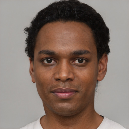 Neutral black young-adult male with short  black hair and brown eyes