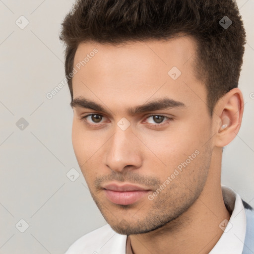 Neutral white young-adult male with short  brown hair and brown eyes