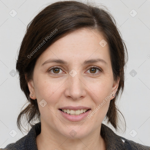 Joyful white adult female with medium  brown hair and grey eyes