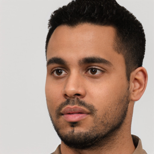 Neutral latino young-adult male with short  black hair and brown eyes