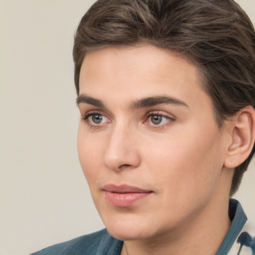 Joyful white young-adult male with medium  brown hair and brown eyes