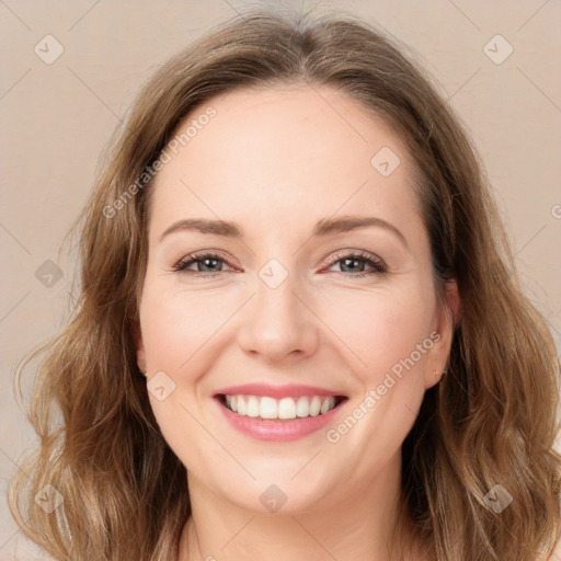 Joyful white young-adult female with long  brown hair and green eyes