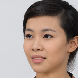 Joyful asian young-adult female with medium  black hair and brown eyes