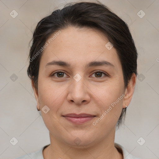 Joyful white adult female with medium  brown hair and brown eyes