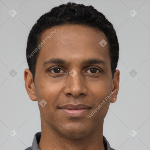 Joyful black young-adult male with short  black hair and brown eyes