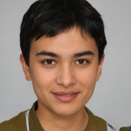 Joyful latino young-adult male with short  brown hair and brown eyes