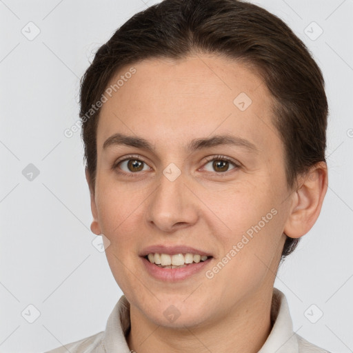 Joyful white young-adult female with short  brown hair and brown eyes