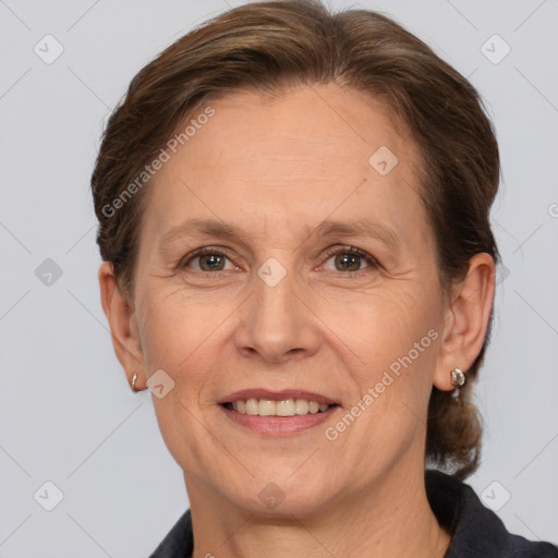 Joyful white adult female with medium  brown hair and brown eyes