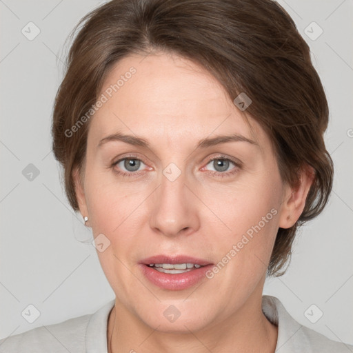 Joyful white adult female with medium  brown hair and grey eyes