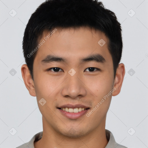 Joyful asian young-adult male with short  black hair and brown eyes