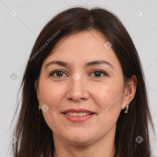 Joyful white adult female with long  brown hair and brown eyes