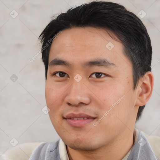 Joyful asian young-adult male with short  black hair and brown eyes