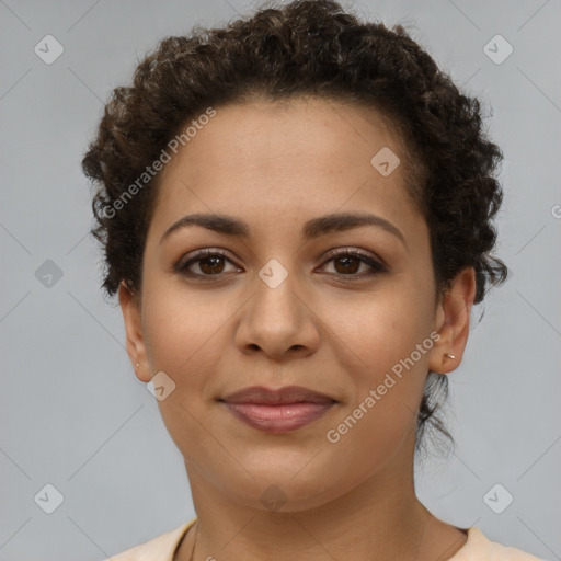 Joyful latino young-adult female with short  brown hair and brown eyes