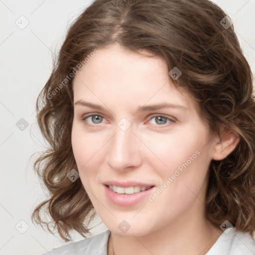 Joyful white young-adult female with medium  brown hair and green eyes