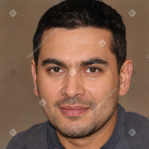 Joyful white adult male with short  black hair and brown eyes