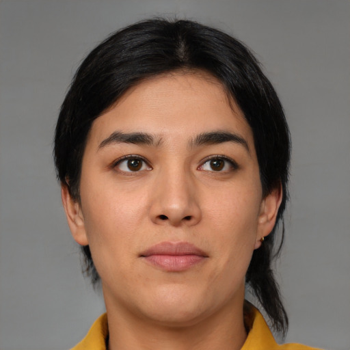 Joyful latino young-adult female with medium  black hair and brown eyes