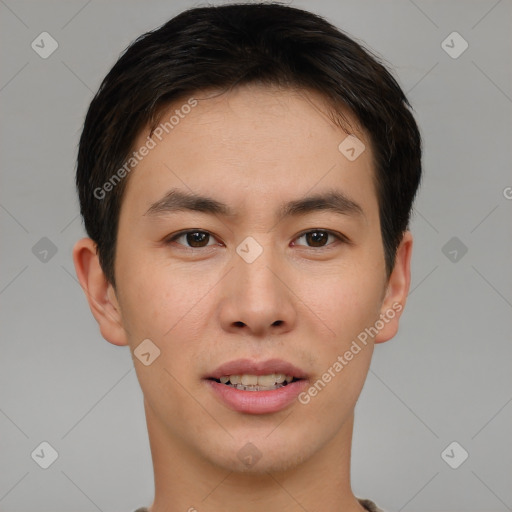 Joyful asian young-adult male with short  brown hair and brown eyes