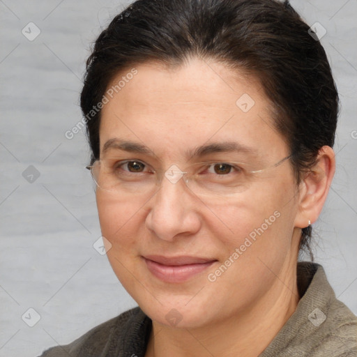 Joyful white adult female with short  brown hair and brown eyes