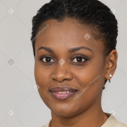 Joyful black young-adult female with short  brown hair and brown eyes