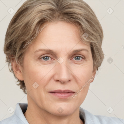 Joyful white adult female with short  brown hair and grey eyes