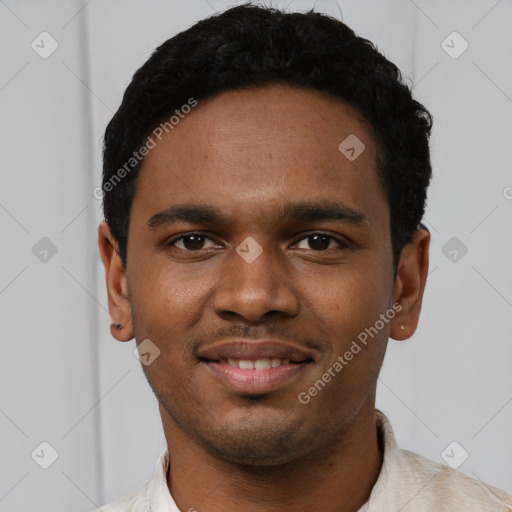 Joyful black young-adult male with short  black hair and brown eyes